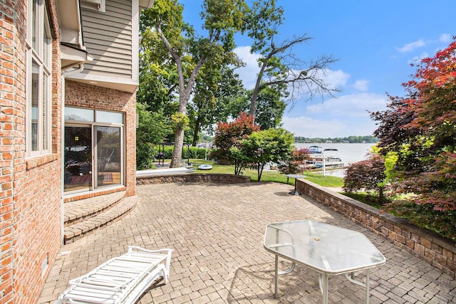 view of patio featuring a water view