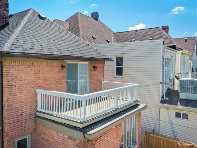 back of property with a balcony