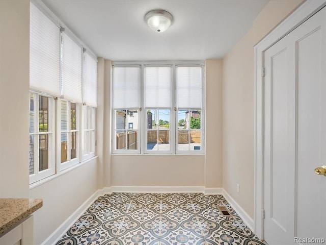 view of unfurnished sunroom