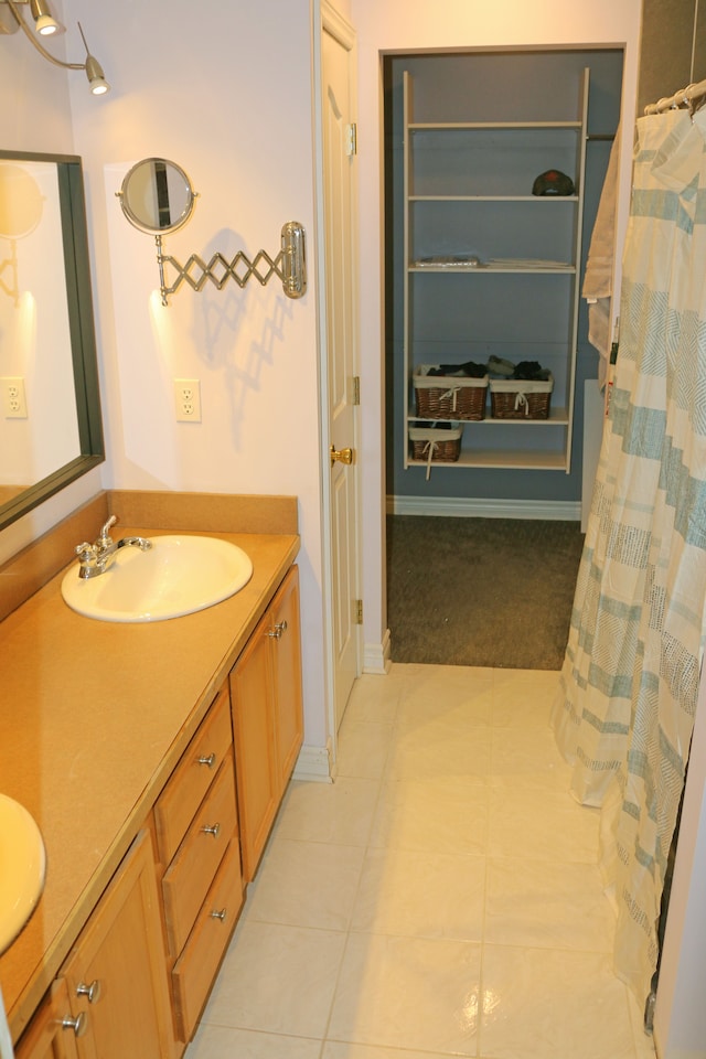 bathroom with vanity and tile patterned floors