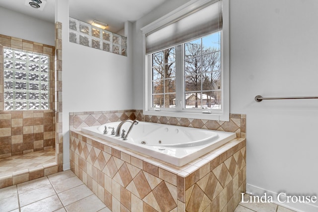 full bathroom featuring tile patterned flooring, tiled shower, and a jetted tub