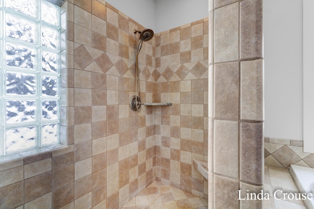 full bathroom with a tile shower