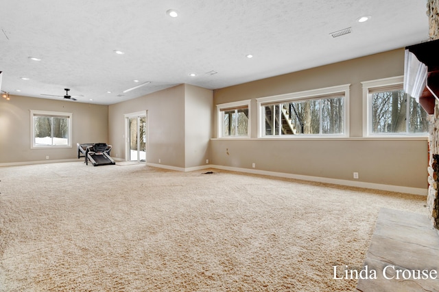 unfurnished room with baseboards, carpet, visible vents, and recessed lighting