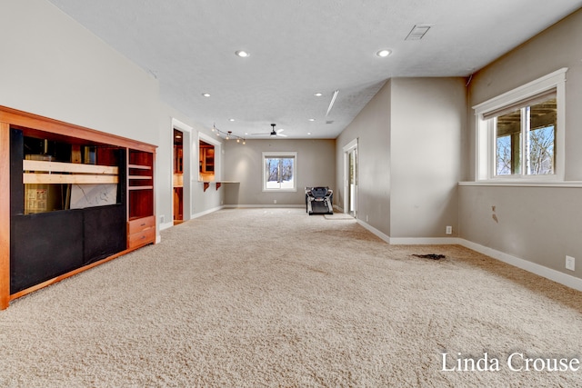 unfurnished living room featuring visible vents, baseboards, a ceiling fan, carpet, and recessed lighting