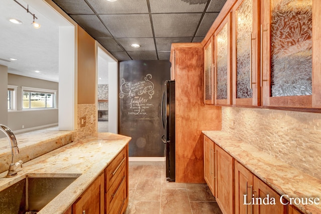 full bathroom featuring tasteful backsplash, a drop ceiling, and vanity