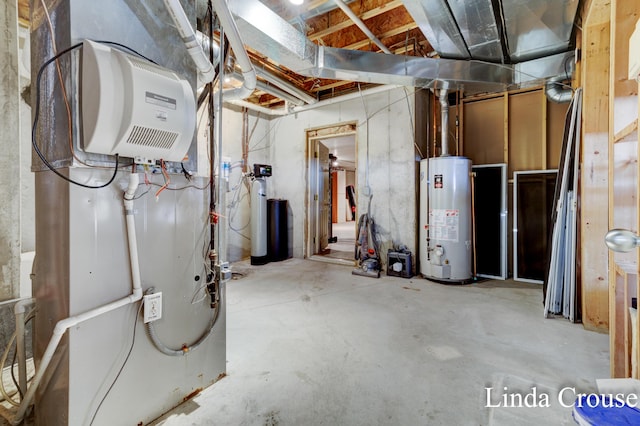 unfinished basement featuring water heater