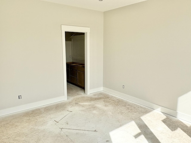 empty room featuring baseboards