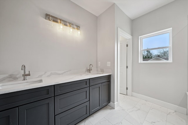 675 Crescent Lake Rd, Waterford, MI 48327 - bathroom featuring double vanity, baseboards, a sink, and marble finish floor