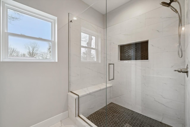 675 Crescent Lake Rd, Waterford, MI 48327 - bathroom featuring baseboards and a marble finish shower