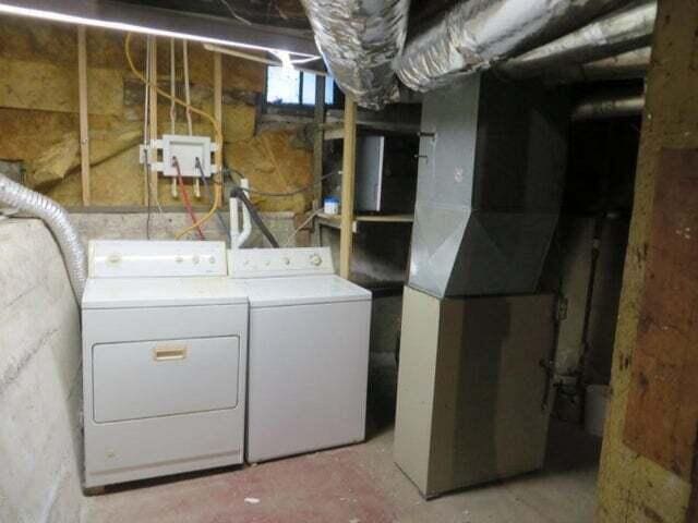 washroom with independent washer and dryer