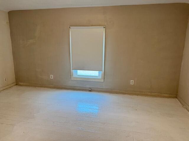 spare room featuring light hardwood / wood-style floors