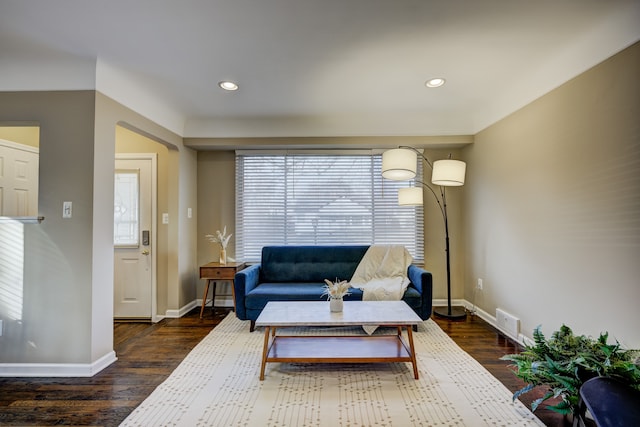 sitting room with dark hardwood / wood-style flooring