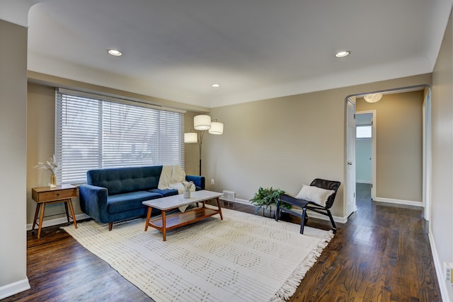 living room featuring dark wood-type flooring