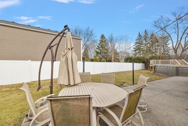 view of patio featuring a fenced backyard and outdoor dining area