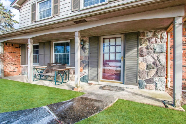 property entrance with covered porch