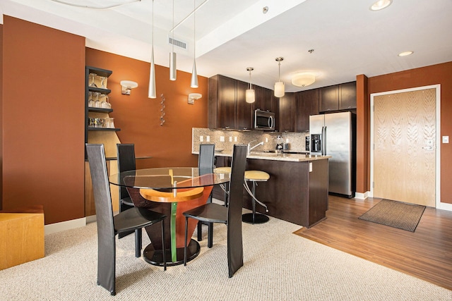 dining area with light wood-type flooring