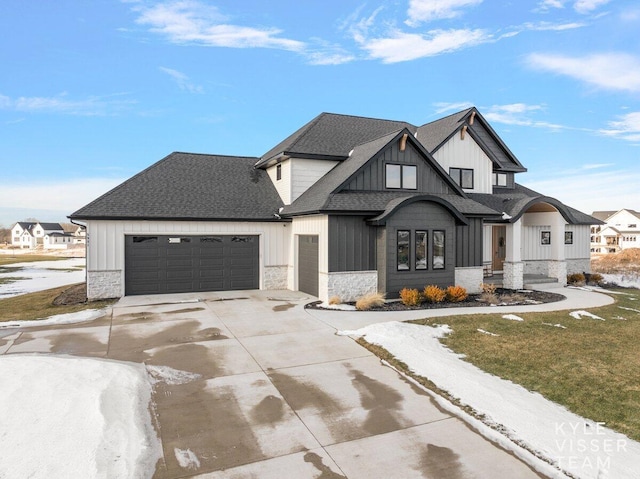 modern farmhouse style home with a garage and a front yard