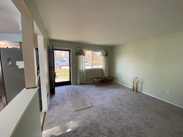 unfurnished room with light colored carpet