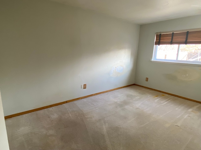 empty room with carpet flooring