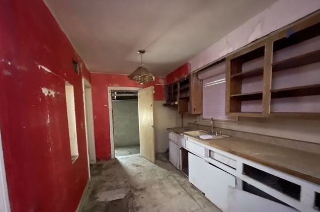 kitchen featuring decorative light fixtures and sink