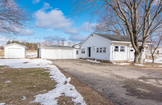 view of front of home with an outbuilding and a garage