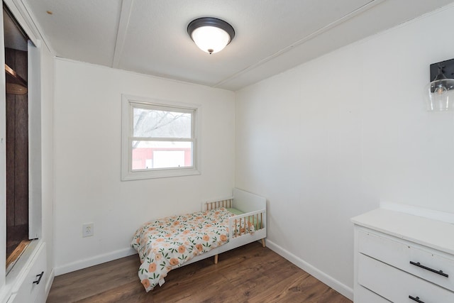 bedroom featuring dark wood-type flooring