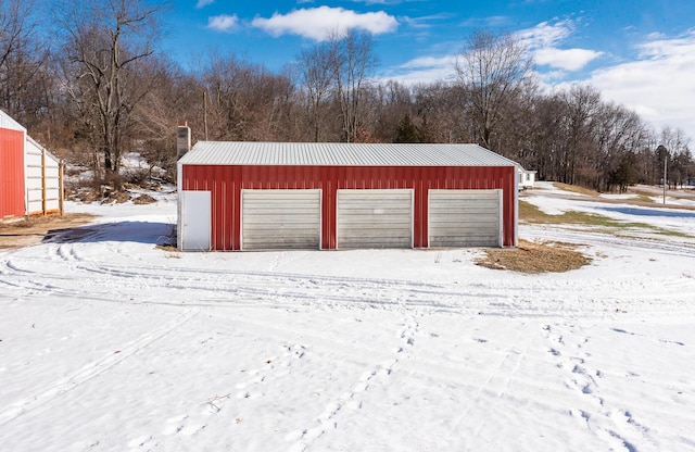 view of snow covered garage