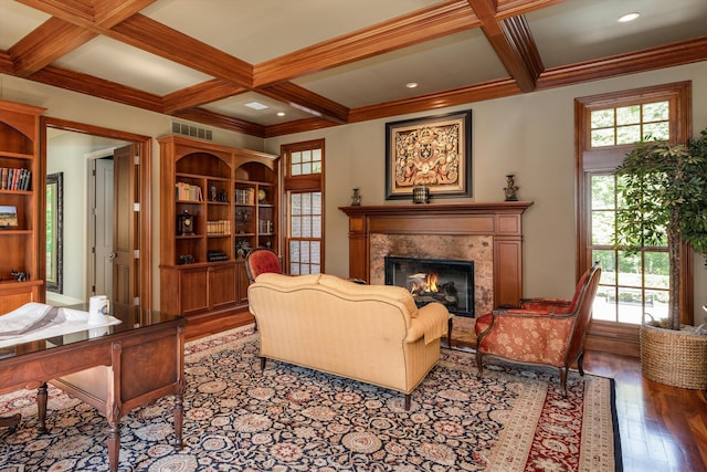 living room featuring visible vents, coffered ceiling, beamed ceiling, wood finished floors, and a high end fireplace