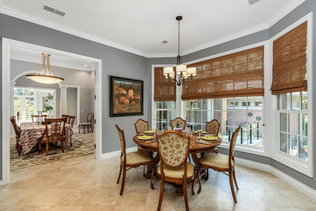 dining space featuring baseboards, visible vents, a notable chandelier, and ornamental molding