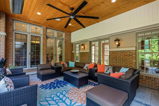 view of patio / terrace featuring an outdoor hangout area, a ceiling fan, and french doors