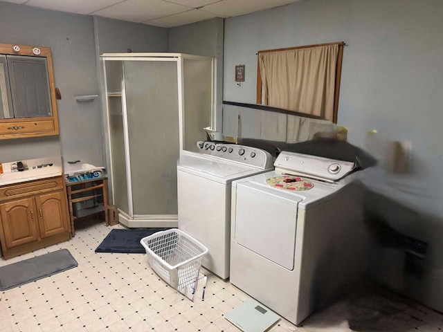 washroom featuring light floors and independent washer and dryer