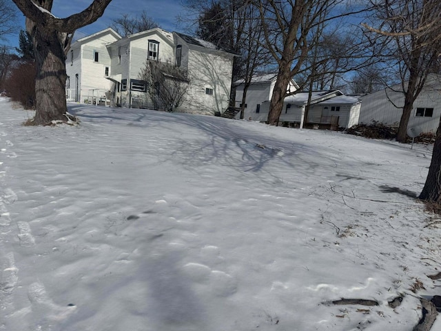 view of yard layered in snow