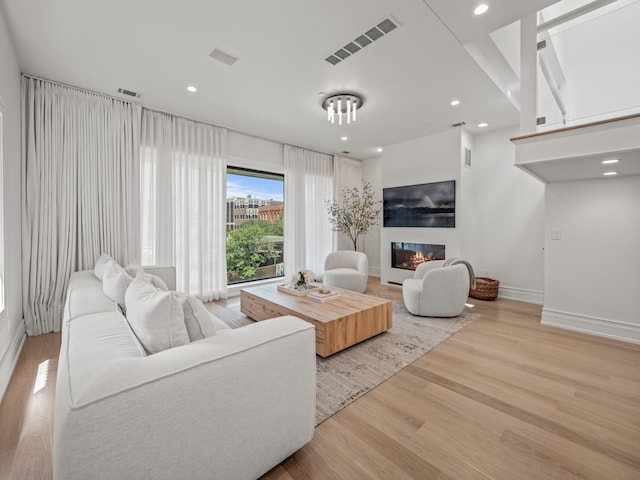 living room with light hardwood / wood-style flooring