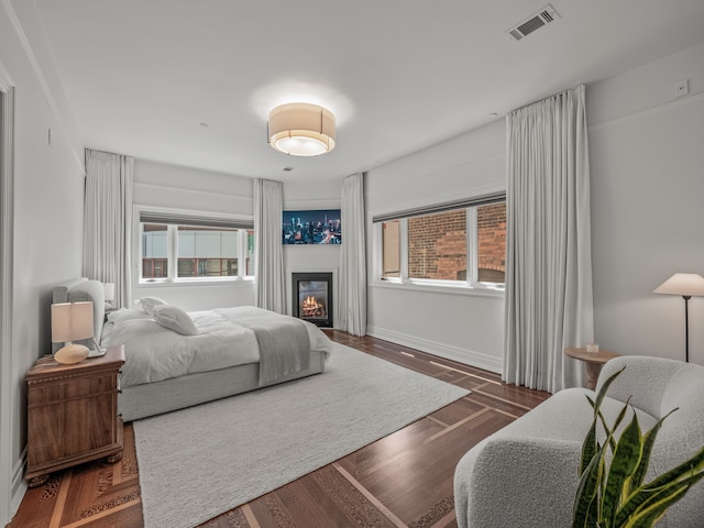 bedroom featuring dark hardwood / wood-style flooring