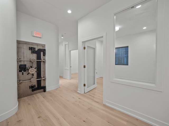 hall with light hardwood / wood-style flooring