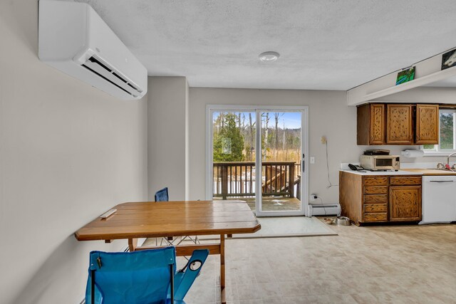 dining space featuring a textured ceiling, a baseboard heating unit, and an AC wall unit