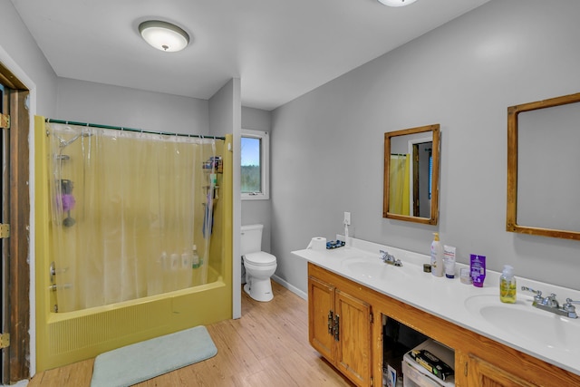 bathroom featuring double vanity, toilet, wood finished floors, shower / bathtub combination with curtain, and a sink