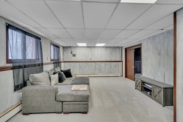 carpeted living room with a baseboard heating unit, a baseboard radiator, and a paneled ceiling