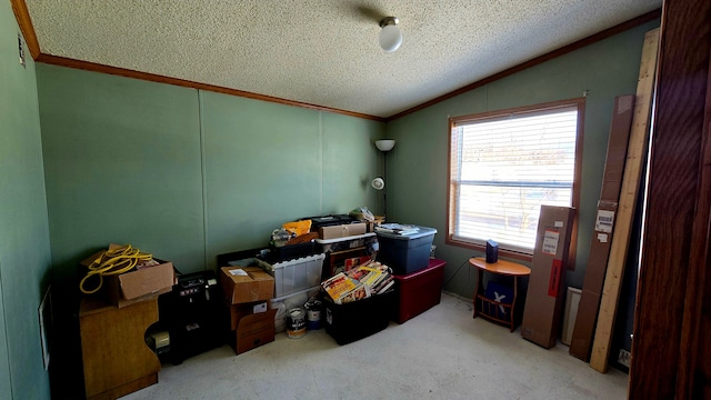 interior space with lofted ceiling, crown molding, and a textured ceiling