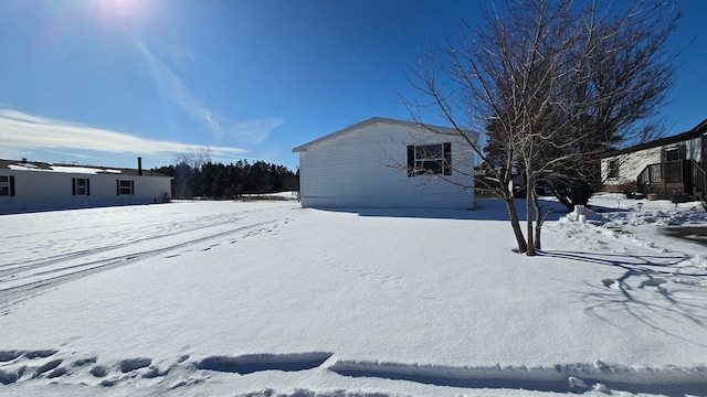 view of yard covered in snow