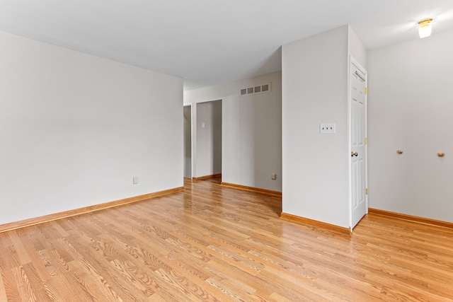 spare room featuring light hardwood / wood-style flooring