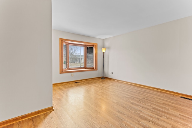 unfurnished room with light hardwood / wood-style flooring