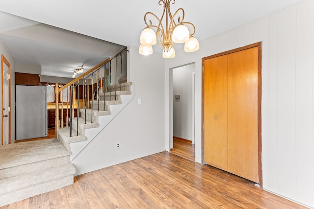 interior space with hardwood / wood-style floors and a notable chandelier