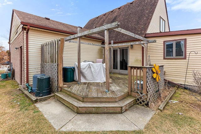 back of house with a wooden deck