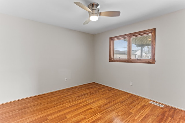 unfurnished room with ceiling fan and light hardwood / wood-style floors