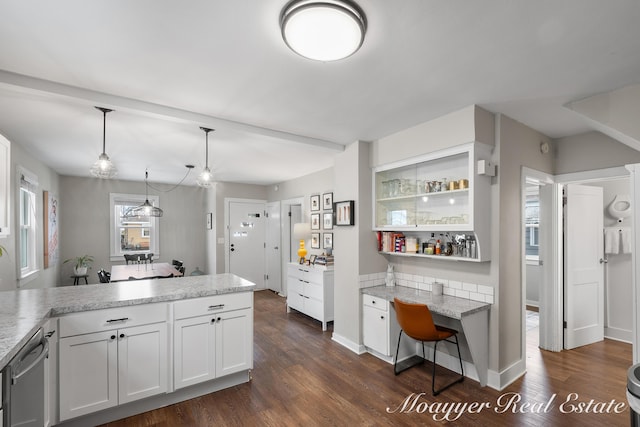 kitchen with white cabinetry, hanging light fixtures, dark hardwood / wood-style flooring, and dishwasher