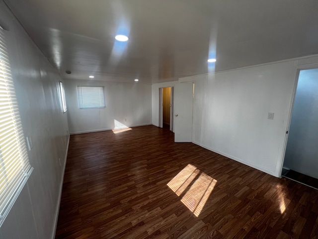 spare room with dark hardwood / wood-style floors