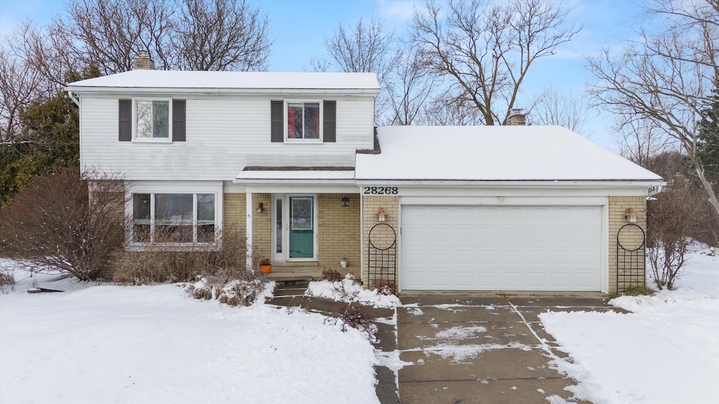 front of property with a garage