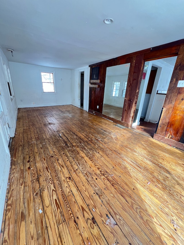 unfurnished living room with hardwood / wood-style floors