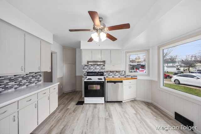 kitchen featuring range with electric stovetop, white cabinetry, stainless steel dishwasher, and light hardwood / wood-style floors